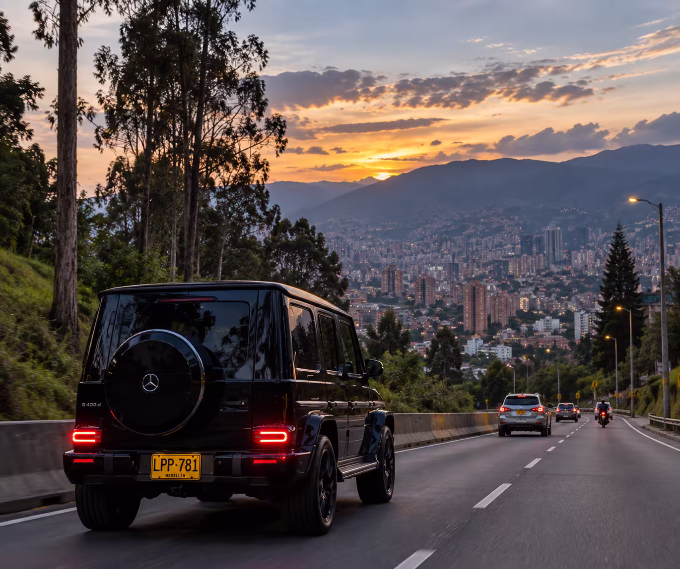 Black SUV driving through Medellín at sunset with a private driver